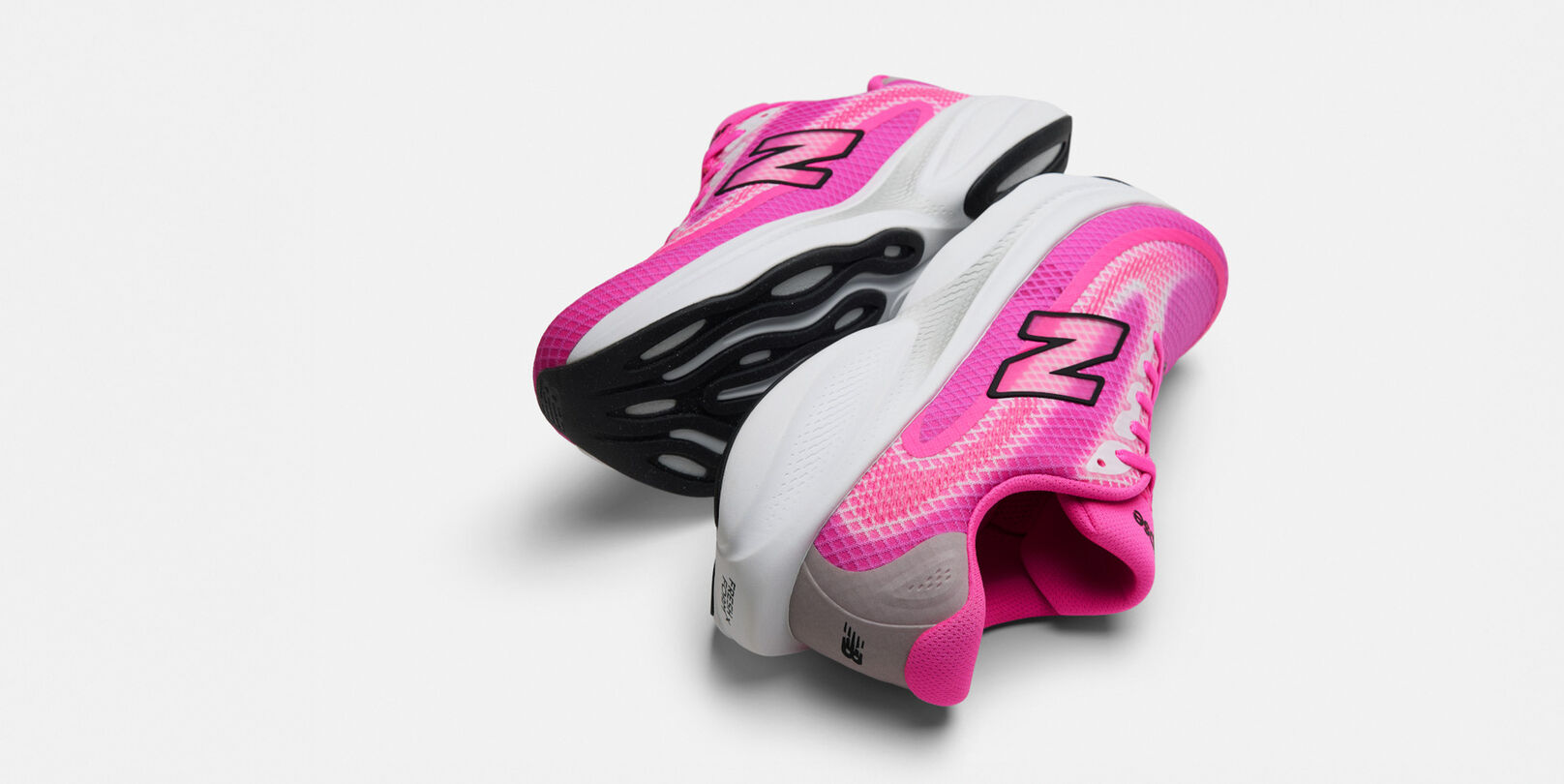 Single pink running shoe on a white background 