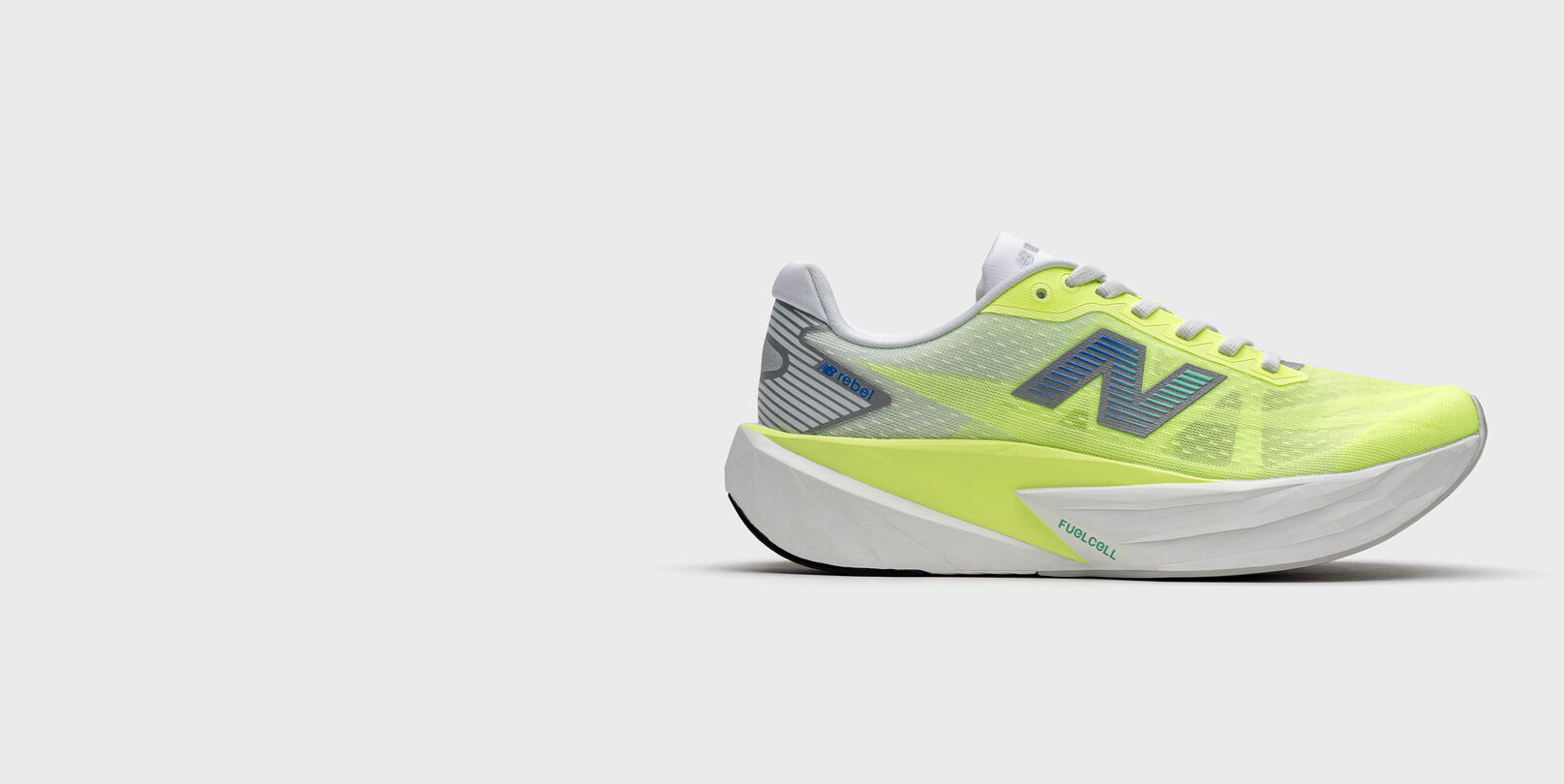 Lime-yellow running shoe with a white midsole and blue New Balance logo, shown on a light gray background. 